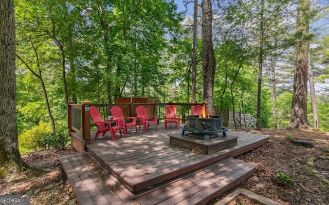 deck featuring a fire pit