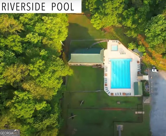 view of subject property featuring a pool area