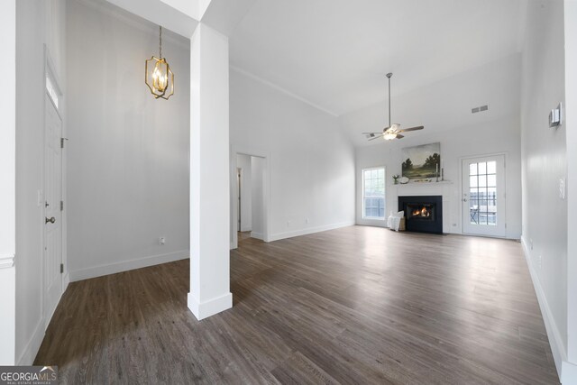 3047 Standing Rock Ct, Lithia Springs, GA 30122 - unfurnished living room featuring ceiling fan with notable chandelier, baseboards, and visible vents