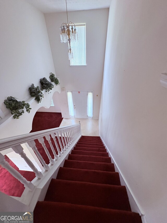 stairway with a towering ceiling