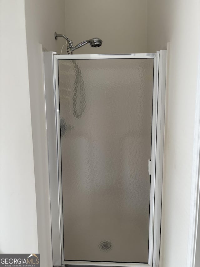 full bathroom with a stall shower