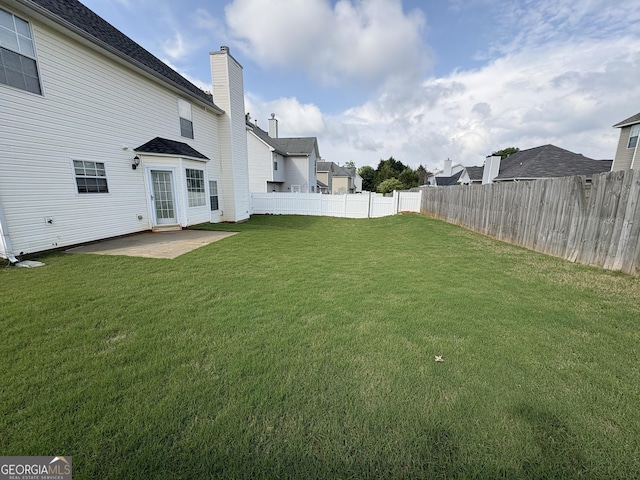 view of yard with a fenced backyard and a patio area