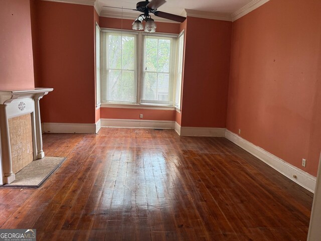 967 Cole St, Macon, GA 31201 - unfurnished living room featuring hardwood / wood-style flooring, baseboards, ornamental molding, and a ceiling fan
