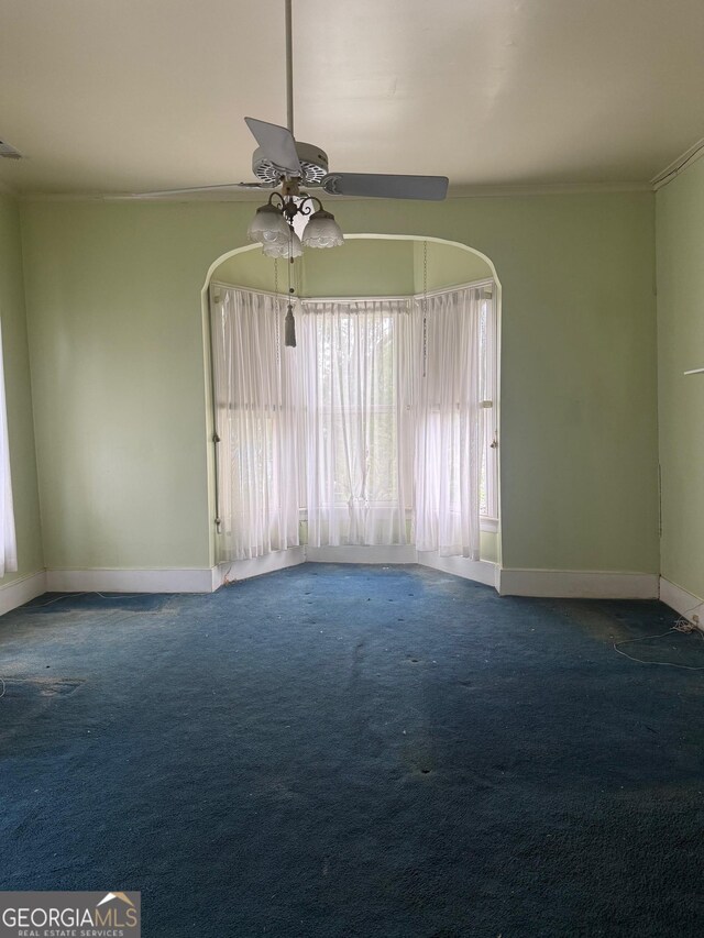 967 Cole St, Macon, GA 31201 - carpeted empty room with ornamental molding, baseboards, and ceiling fan