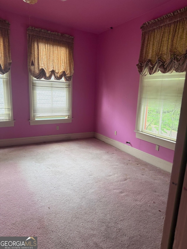 967 Cole St, Macon, GA 31201 - carpeted empty room featuring baseboards and a healthy amount of sunlight