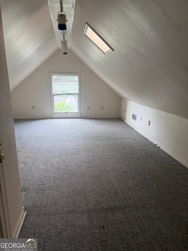 967 Cole St, Macon, GA 31201 - additional living space featuring vaulted ceiling, baseboards, and carpet floors