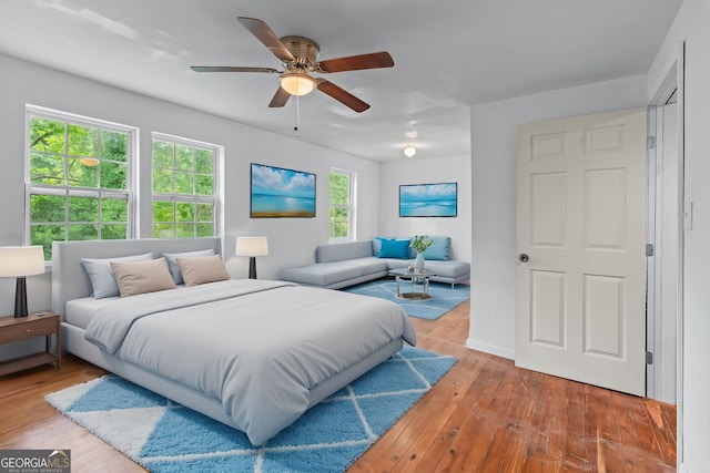 bedroom featuring a ceiling fan and hardwood / wood-style flooring