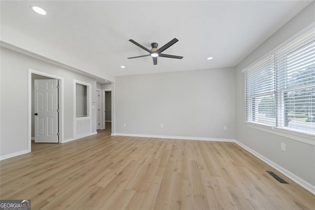 interior space with light wood-type flooring, baseboards, recessed lighting, visible vents, and ceiling fan