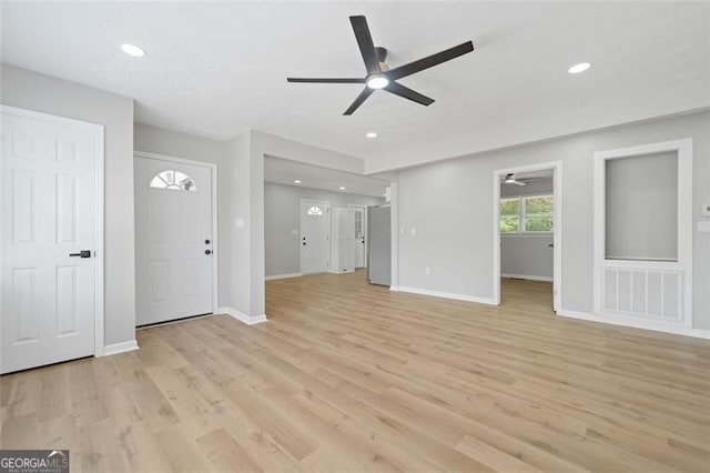 unfurnished living room with recessed lighting, visible vents, a ceiling fan, light wood-type flooring, and baseboards