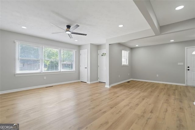 unfurnished living room featuring recessed lighting, visible vents, a ceiling fan, baseboards, and light wood-style flooring