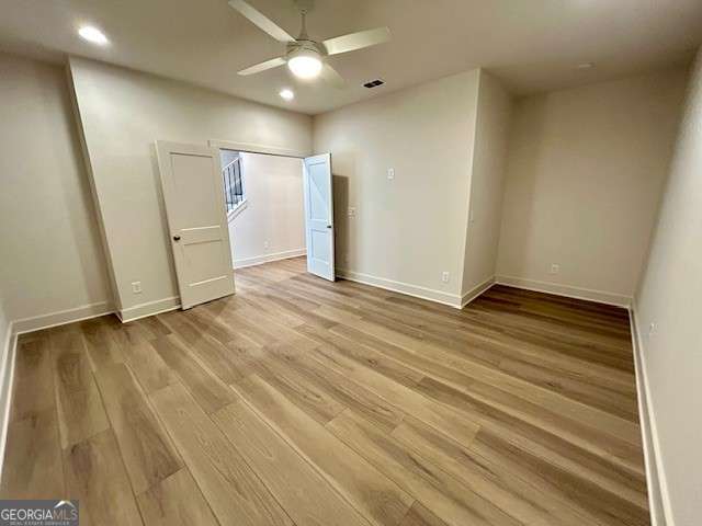 empty room featuring recessed lighting, ceiling fan, baseboards, and light wood-type flooring