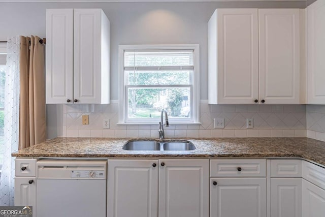 4319 Silver Peak Pkwy, Suwanee, GA 30024 - kitchen with white cabinets, a sink, white dishwasher, light stone countertops, and decorative backsplash