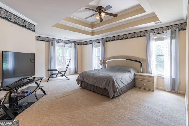4319 Silver Peak Pkwy, Suwanee, GA 30024 - carpeted bedroom with a ceiling fan, visible vents, a raised ceiling, and ornamental molding
