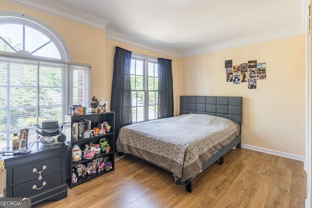4319 Silver Peak Pkwy, Suwanee, GA 30024 - bedroom with light wood-type flooring, baseboards, and ornamental molding