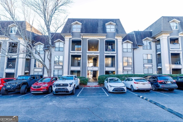 2657 Lenox Road Ne 68Bldg E, Atlanta, GA 30324 - view of property featuring uncovered parking