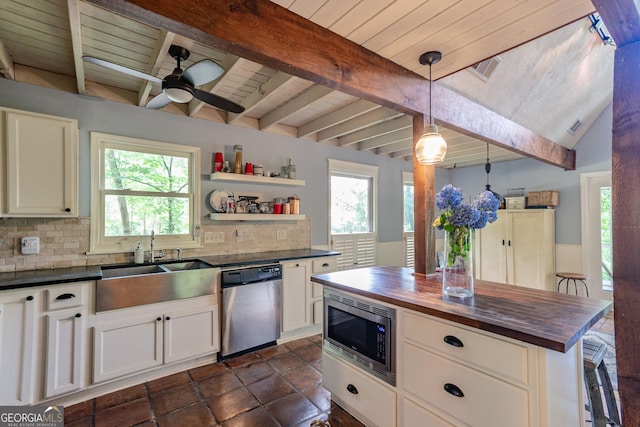 9240 Lisa Cir, Gainesville, GA 30506 - kitchen featuring stainless steel appliances, wood counters, backsplash, a wood ceiling with exposed beams, and white cabinetry