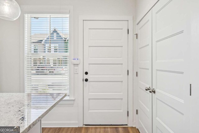 1095 Tucker Ave Unit 207, Atlanta, GA 30310 - doorway to outside with wood finished floors and healthy amount of natural light