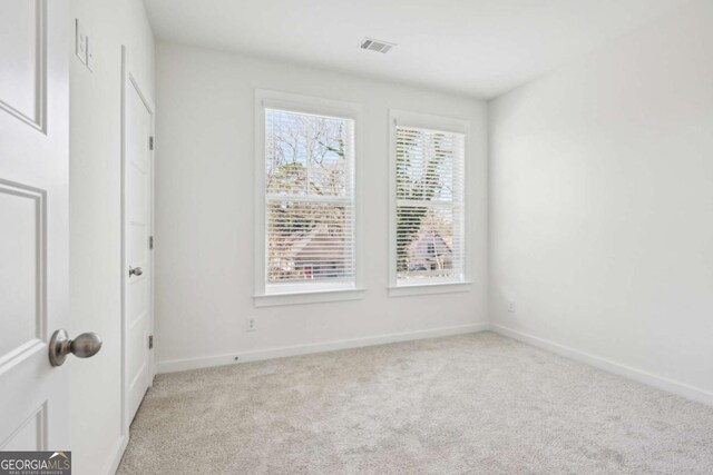 1095 Tucker Ave Unit 207, Atlanta, GA 30310 - spare room with light colored carpet and baseboards