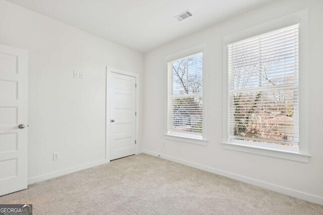 1095 Tucker Ave Unit 207, Atlanta, GA 30310 - carpeted spare room with baseboards