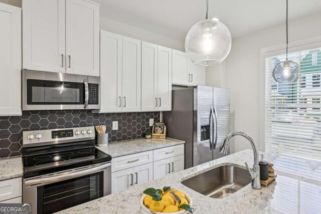 1095 Tucker Ave Unit 207, Atlanta, GA 30310 - kitchen featuring appliances with stainless steel finishes, a sink, and white cabinetry