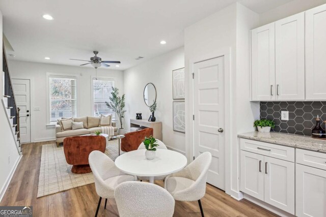 1095 Tucker Ave Unit 207, Atlanta, GA 30310 - dining area featuring stairway, light wood finished floors, ceiling fan, recessed lighting, and baseboards
