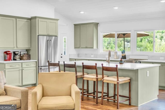 2180 Pine Lake Rd, Hiawassee, GA 30546 - kitchen with light countertops, green cabinets, and high end fridge