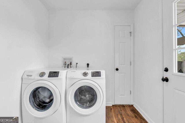 2180 Pine Lake Rd, Hiawassee, GA 30546 - laundry room with wood finished floors, washing machine and clothes dryer, and laundry area