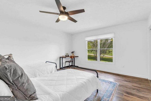 2180 Pine Lake Rd, Hiawassee, GA 30546 - bedroom with baseboards, a ceiling fan, and wood finished floors