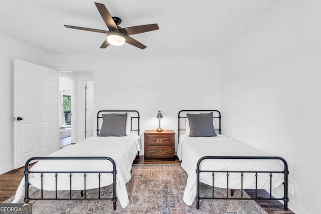 2180 Pine Lake Rd, Hiawassee, GA 30546 - bedroom featuring ceiling fan, baseboards, and wood finished floors