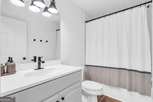 2180 Pine Lake Rd, Hiawassee, GA 30546 - bathroom with wood finished floors, toilet, and vanity
