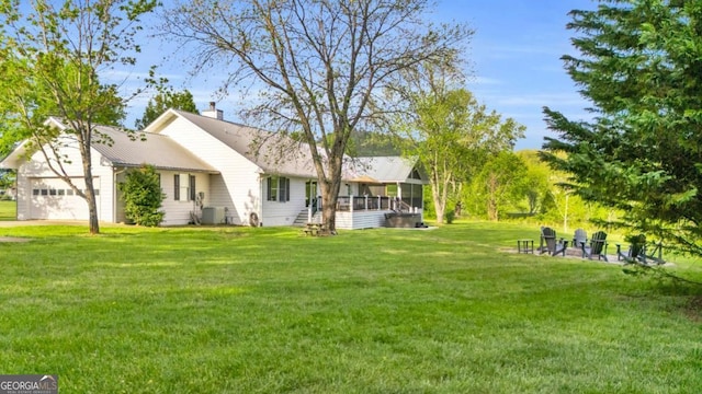 2180 Pine Lake Rd, Hiawassee, GA 30546 - view of yard featuring central air condition unit, a sunroom, and a garage