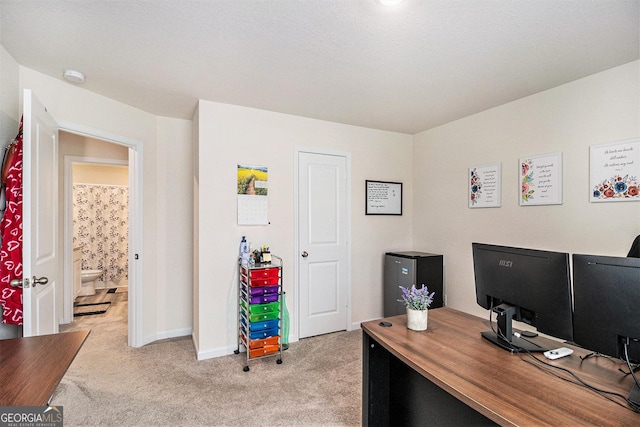 231 Limestone Cir, Conyers, GA 30013 - office area with baseboards and light colored carpet