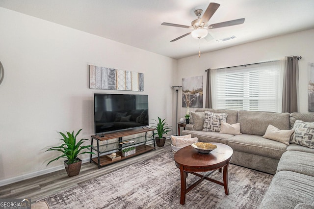 231 Limestone Cir, Conyers, GA 30013 - living room featuring visible vents, baseboards, wood finished floors, and ceiling fan