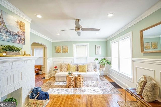 98 Chappell Rd NW, Atlanta, GA 30314 - living area with a wainscoted wall, wood finished floors, arched walkways, and ceiling fan