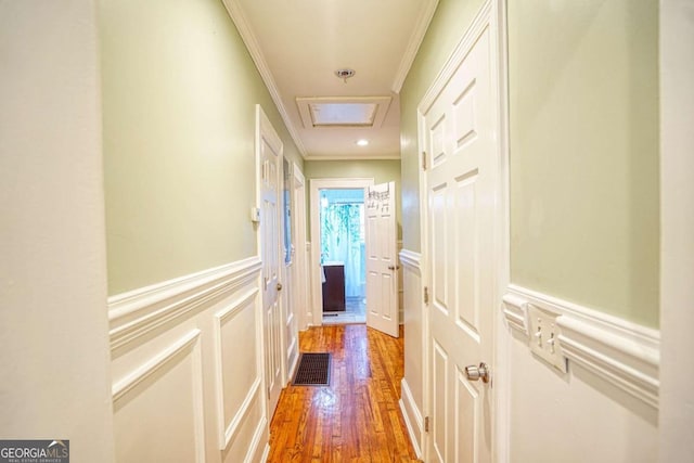 98 Chappell Rd NW, Atlanta, GA 30314 - hall with wood finished floors, visible vents, ornamental molding, a decorative wall, and wainscoting