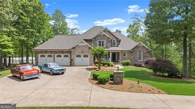 922 Florence Rd, Douglasville, GA 30134 - craftsman-style house with concrete driveway, stone siding, a front lawn, an attached garage, and a chimney