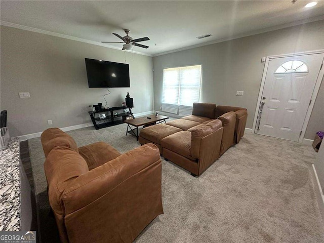 living room with ceiling fan, light carpet, baseboards, and ornamental molding