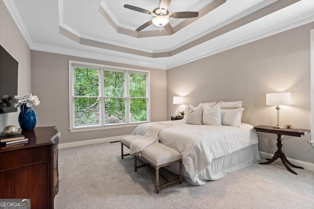 bedroom with crown molding, baseboards, and light colored carpet