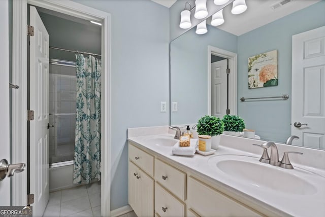 full bathroom featuring double vanity, tile patterned floors, shower / bathtub combination with curtain, and a sink