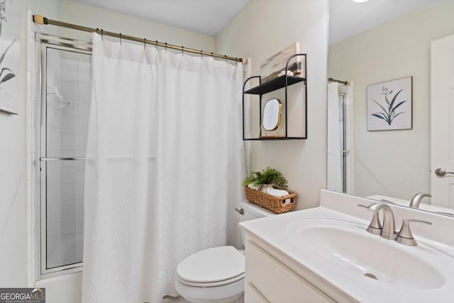 bathroom with toilet, a shower with shower curtain, and vanity