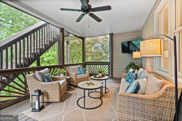 exterior space featuring an outdoor hangout area and ceiling fan