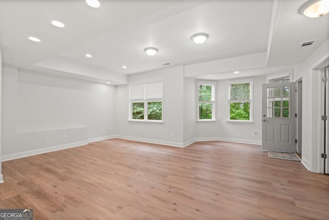 interior space featuring recessed lighting, baseboards, visible vents, and light wood-style floors