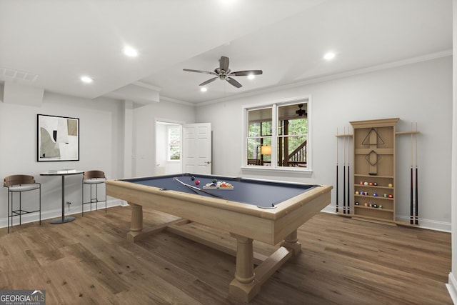 game room featuring visible vents, ornamental molding, ceiling fan, and wood finished floors