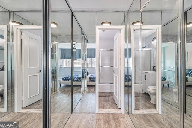 215 Piedmont Ave NE Unit 2210, Atlanta, GA 30308 - ensuite bathroom with wood finished floors, toilet, and ensuite bathroom