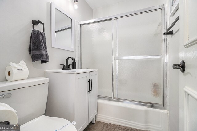 215 Piedmont Ave NE Unit 2210, Atlanta, GA 30308 - full bath with wood finished floors, combined bath / shower with glass door, toilet, and vanity