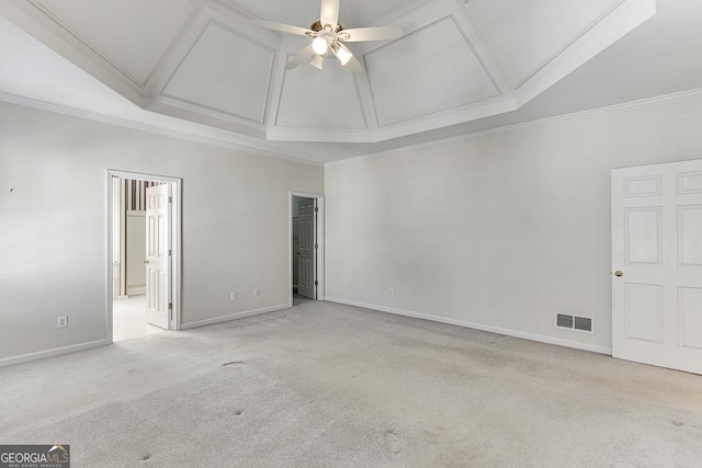 unfurnished bedroom featuring carpet flooring, ensuite bath, baseboards, crown molding, and ceiling fan