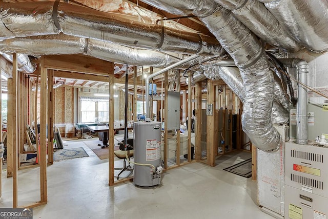 below grade area featuring water heater and electric panel