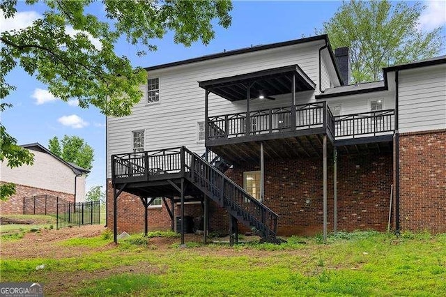 back of property with central AC, a chimney, fence, stairs, and a deck