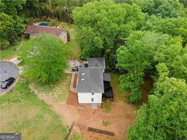 aerial view with a wooded view