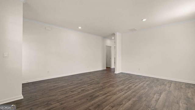 1109 Blue Juniper Cir, Loganville, GA 30052 - empty room featuring dark wood finished floors, crown molding, and recessed lighting